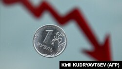 Монета номіналом 1 рубль на тлі графіка. Ілюстраційний колаж
