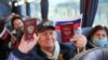 Жителі Донецька показують свої російські паспорти в автобусі, який має їх доправити до виборчої дільниці в Ростовській області Росії для голосування у виборах до російської Держдуми. 17 вересня 2021 року